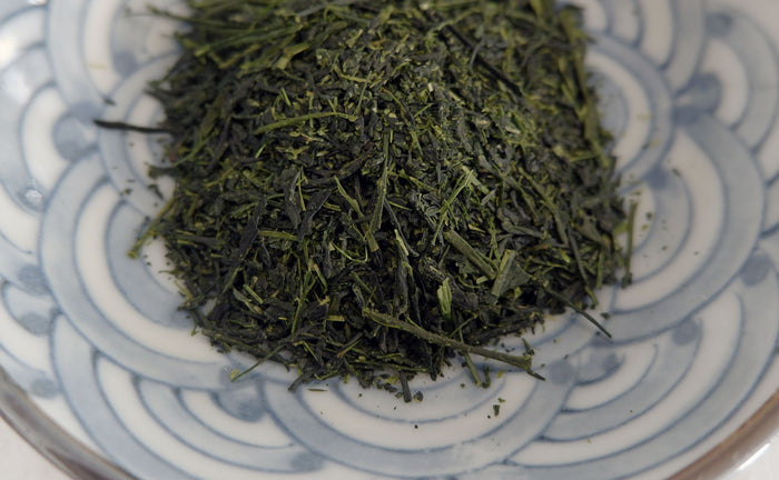sencha green tea in a blue patterned bowl