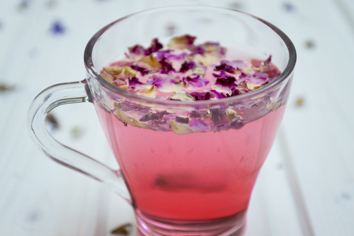 A glass mug full of the new green tea, Sun Rouge