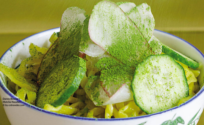 a salad dotted with cucumbers and sprinkled with matcha green tea