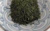 sencha green tea in a blue patterned bowl